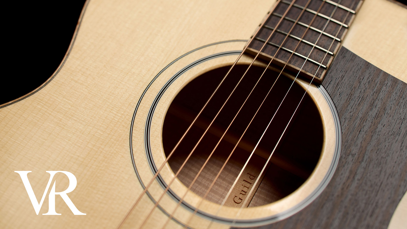 Close-up of ThinWood™ pickguard on acoustic guitar